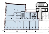 Grundriss eines Gebäudes mit mehreren Räumen, Treppenhaus und Sanitäranlagen, grau und weiß.
